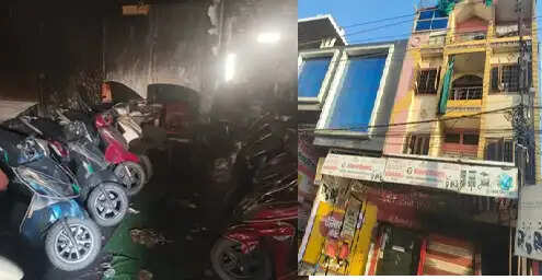 विदिशा में ईवी शोरूम में भीषण आग से 35 गाड़ियां हुईं खाक, ऊपर फंसे दो परिवारों का जेसीबी से किया रेस्क्यू